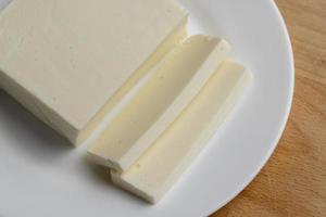 Sliced cream cheese for salads photo