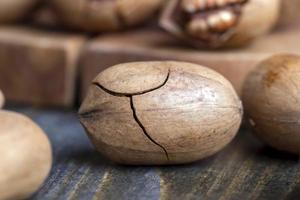 Pecan in a shell on the table photo