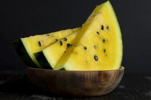 Sliced ripe yellow watermelon, close up photo