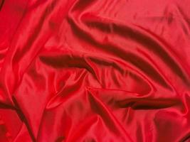Red fabric texture for backgroundwith coy space. Valentines Day or Christmas Day wallpaper design photo