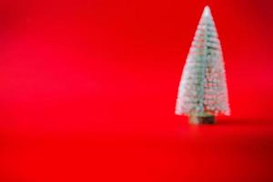 Abstract blur Christmas tree on red background new year  holiday celebration concept photo