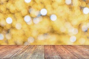 Empty wood table top with blur Christmas tree with bokeh light background photo