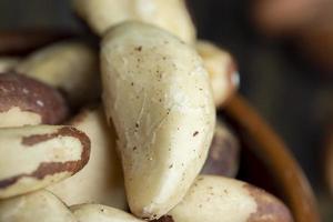 Peeled Brazil nuts on the table photo