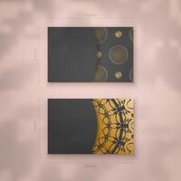 Presentable business card in black with Indian gold pattern for your brand. vector