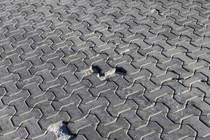 part of the road made of concrete tiles photo
