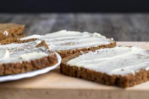 Black rye bread with butter photo