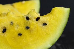 Sliced ripe yellow watermelon, close up photo