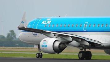 AMSTERDAM, THE NETHERLANDS JULY 22, 2017 - KLM Embraer 175 aircraft taking off from Schiphol Airport, early morning video