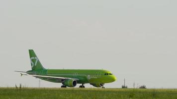 KAZAN, RUSSIA AUGUST 05, 2022 - Airplane of S7 airlines on the runway at Kazan airport. Jet plane on the airfield on a summer day. Tourism and travel concept video