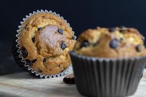 Cupcake with chocolate pieces, close up photo