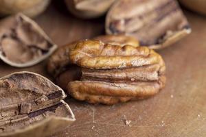 Pecan in a shell on the table photo
