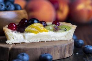 delicious cake with different berries photo