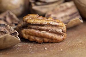 Pecan in a shell on the table photo