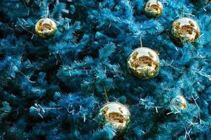 Turquoise Christmas Tree and Decorative Golden Balls photo