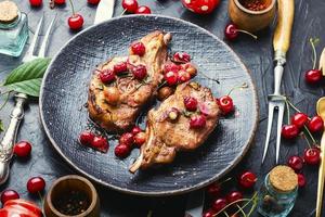 Meat pork in cherry sauce photo