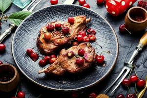 Meat pork in cherry sauce photo