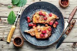 Grilled pork steaks with cherry sauce photo