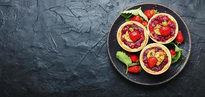 Summer tartlets with strawberries photo