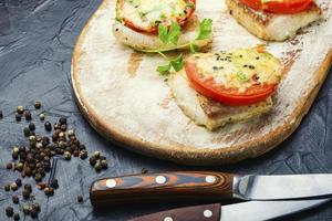 Fish baked with cheese,pangasius fillet photo
