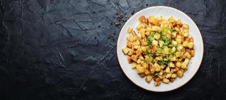 Fried potatoes with green onions, space for text photo