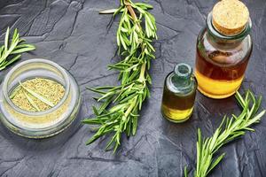 Fresh organic rosemary essential oil photo