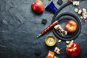 Smoking hookah with apple flavor,copy space photo