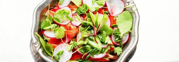 Summer vitamin salad on a metal plate photo