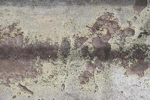 Detailed close up view on aged concrete walls with cracks and lots of structure photo