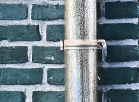 Detailed view at a colorful old and weathered brick wall texture as a panoramic background. photo