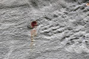 Detailed view on aged concrete walls with cracks and a lot of structure in high resolution photo