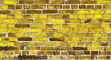 Detailed view at a colorful old and weathered brick wall texture as a panoramic background. photo