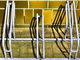 Detailed view at a colorful old and weathered brick wall texture as a panoramic background. photo