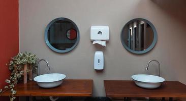 clean white vintage bathroom sink and mirror photo