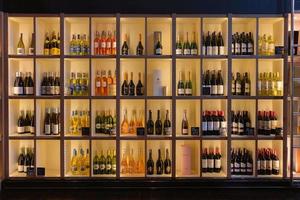 wine and champagne in wooden shelves photo