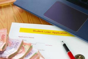 student loan application form on wooden table photo