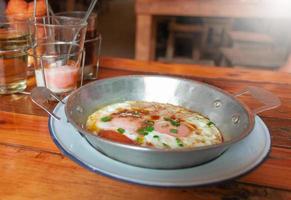 egg pan with breakfast morning set on wooden table photo