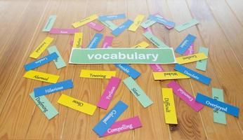 colorful English word cards on wooden table photo