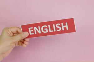 hand holding colorful sign of English learning skills photo