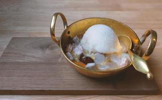 Thai sweet shaved ice with fruit in coconut milk photo