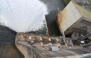 A spillway of dam to provide the controlled release of water from a dam or levee downstream. photo