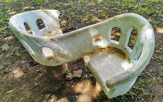 Artfully curved stone bench in city park Playa del Carmen. photo