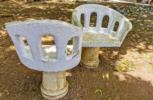 Artfully curved stone bench in city park Playa del Carmen. photo