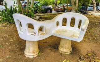Playa del Carmen Quintana Roo Mexico 2022 Artfully curved stone bench in city park Playa del Carmen. photo