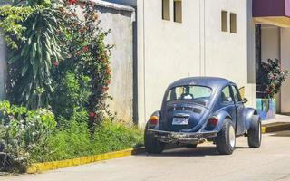 Puerto Escondido Oaxaca Mexico 2022 Various colorful tuned cars and classic vintage cars  Mexico. photo