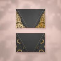 Presentable business card in black with luxurious gold ornaments for your brand. vector