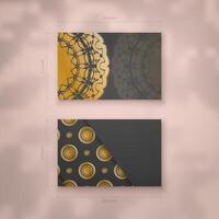 A presentable business card in black with a luxurious gold pattern for your contacts. vector