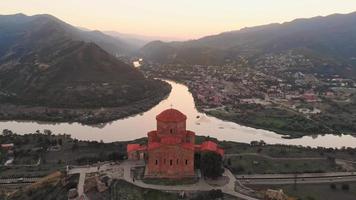 Fly over Jvari, historical church over the beautiful city Mtskheta video
