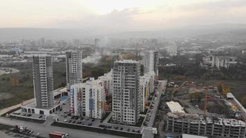 Aerial drone shot flying over residential apartment buildings and commercial property in urban north Tbilisi neighborhood in caucasus, Georgia video