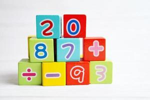 Number wood block cubes for learning Mathematic, education math concept. photo