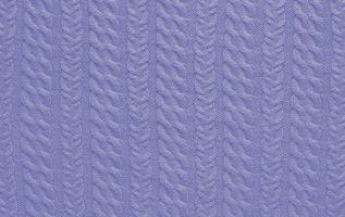 Texture of smooth knitted sweater with pattern. Handmade knitting wool or cotton fabric texture. Background of knitting patterns with a vertical Braid Cable. photo
